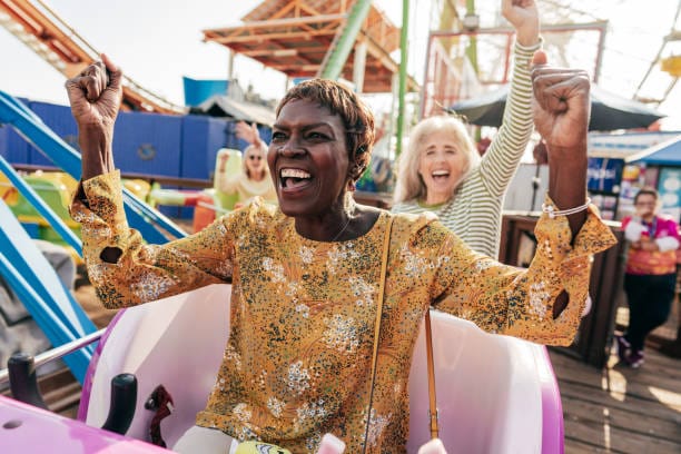 Close up of a group of seniors during their trip on an amusement park | Mental Balance Series | Mental Balance Series emotions